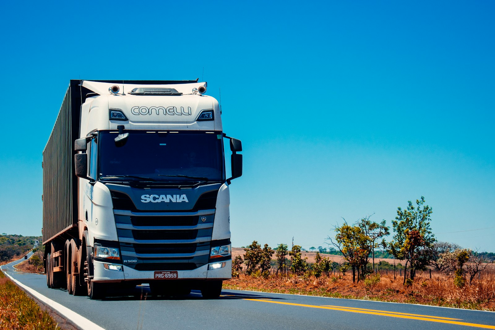 Fasgo delivery truck fleet on highway